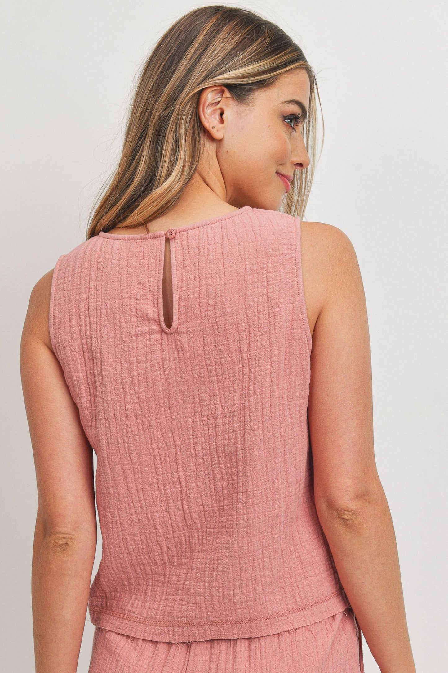 Round Neck Inbinding Finish With Raw Edge Sweep Back Button